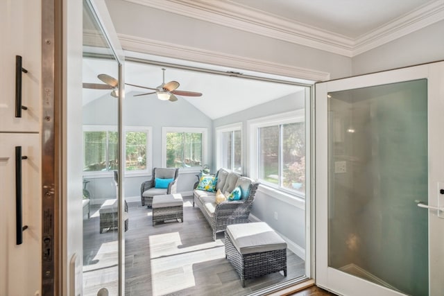 sunroom / solarium featuring ceiling fan, plenty of natural light, and vaulted ceiling