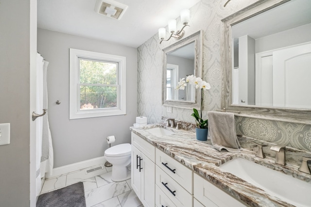 bathroom featuring walk in shower, vanity, and toilet