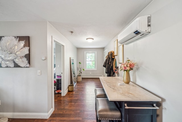 doorway to outside with dark wood-type flooring, a baseboard heating unit, and an AC wall unit