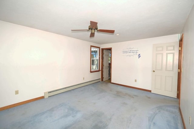 spare room with baseboards, carpet, ceiling fan, and a baseboard heating unit