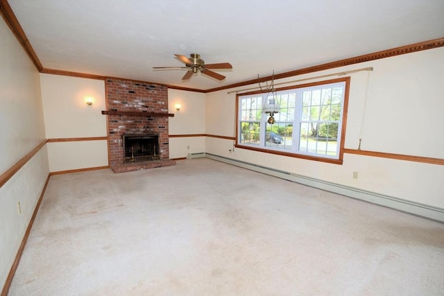 unfurnished living room with a ceiling fan, baseboard heating, a fireplace, carpet floors, and ornamental molding