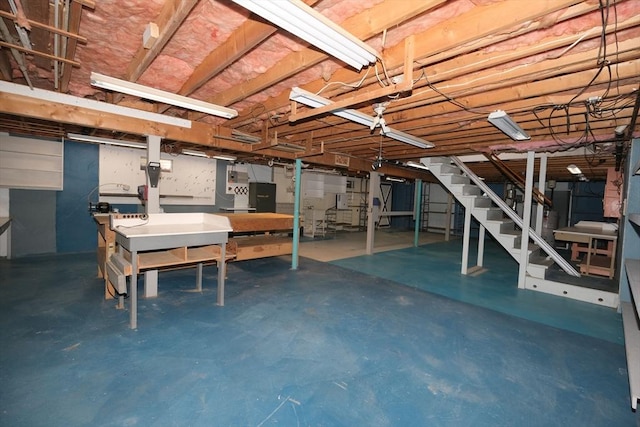 unfinished below grade area featuring stairs