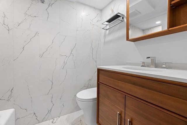 bathroom with toilet, marble finish floor, walk in shower, and vanity