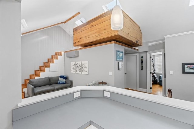 interior space featuring vaulted ceiling, a wall mounted air conditioner, and stairs