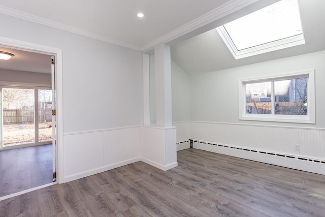 unfurnished room with crown molding, a baseboard radiator, recessed lighting, baseboard heating, and wood finished floors