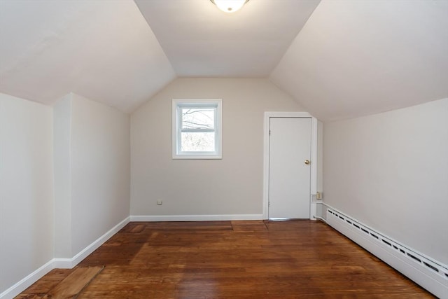 bonus room with a baseboard radiator, baseboards, vaulted ceiling, and wood finished floors