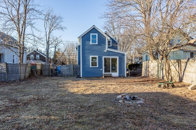 back of house featuring fence