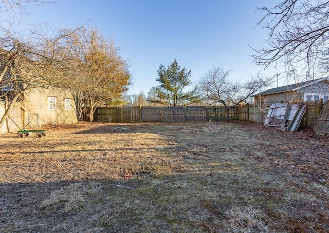 view of yard with a fenced backyard