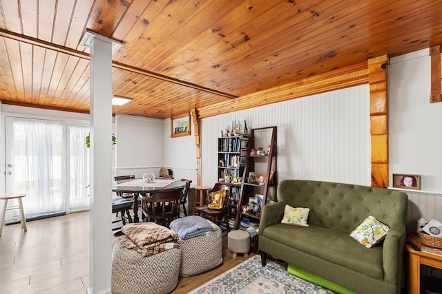 living room with wooden ceiling and wood finished floors