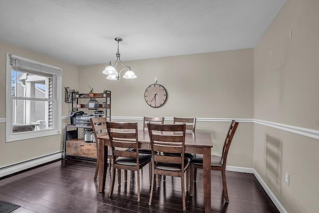 dining area with a baseboard radiator, an inviting chandelier, and dark wood-type flooring