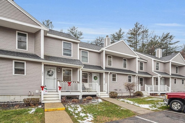 townhome / multi-family property featuring a porch