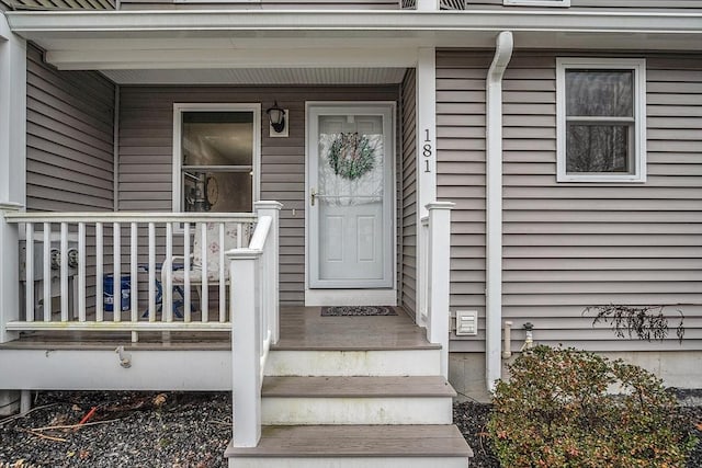 view of exterior entry featuring a porch