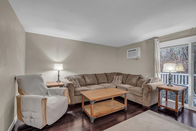 living room featuring dark hardwood / wood-style flooring and a wall mounted AC