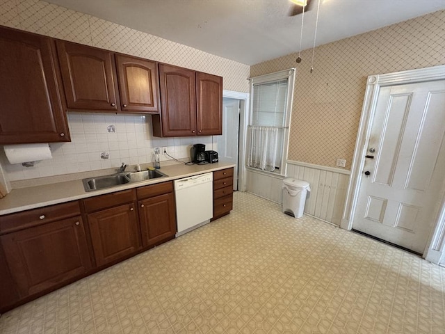 915 E 4th St, Boston, MA 02127 - kitchen with dishwasher, a sink, light countertops, light floors, and wainscoting