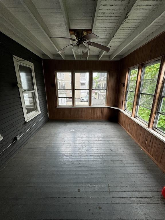 915 E 4th St, Boston, MA 02127 - unfurnished sunroom with wood walls, wood-type flooring, beam ceiling, and wooden ceiling