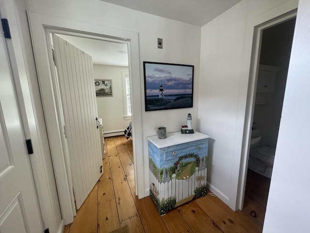 17 Hydrangea Ln Unit 786, Mashpee, MA 02649 - hallway with light wood-style flooring, a baseboard heating unit, and baseboards