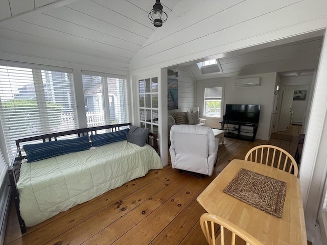 17 Hydrangea Ln Unit 786, Mashpee, MA 02649 - bedroom featuring an AC wall unit, vaulted ceiling, and hardwood / wood-style floors