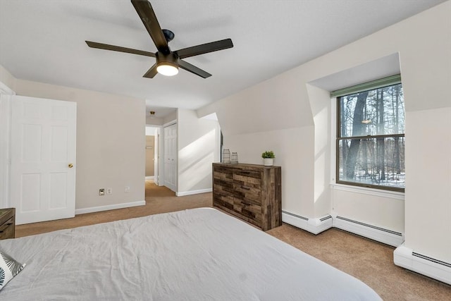 carpeted bedroom with a baseboard heating unit, baseboards, lofted ceiling, and ceiling fan