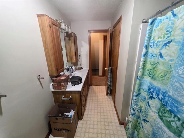 209-211 Ventura St, Ludlow, MA 01056 - bathroom with tile patterned floors, vanity, and curtained shower