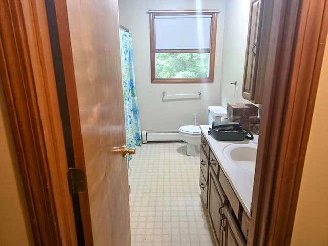 209-211 Ventura St, Ludlow, MA 01056 - bathroom featuring baseboard heating, tile patterned floors, vanity, and curtained shower