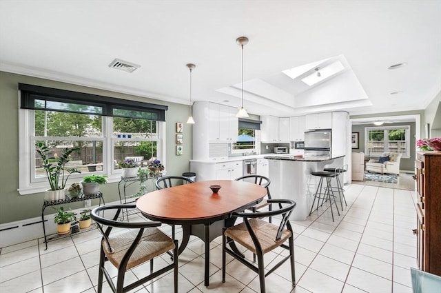 64 Pond St, Nahant, MA 01908 - dining area with a skylight, a tray ceiling, light tile patterned floors, and ornamental molding