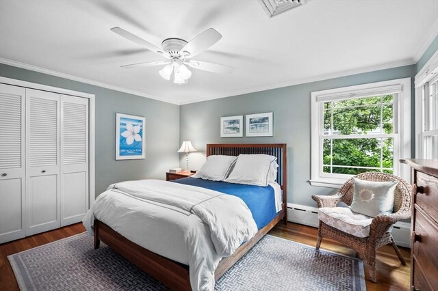 64 Pond St, Nahant, MA 01908 - bedroom featuring wood finished floors, ornamental molding, a closet, baseboard heating, and a ceiling fan