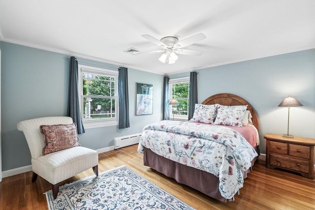 64 Pond St, Nahant, MA 01908 - bedroom with a baseboard heating unit, light wood-style flooring, ornamental molding, and ceiling fan