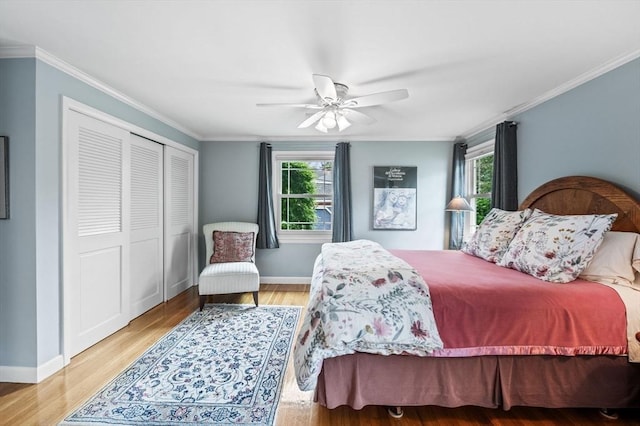 64 Pond St, Nahant, MA 01908 - bedroom featuring multiple windows, wood finished floors, a closet, crown molding, and a ceiling fan
