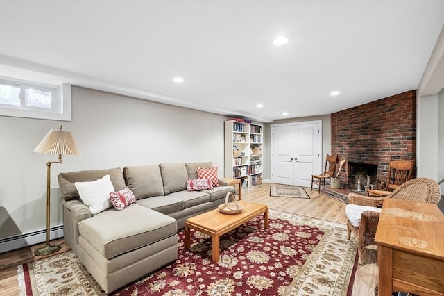 64 Pond St, Nahant, MA 01908 - living area with light wood-style floors, recessed lighting, a brick fireplace, and baseboard heating
