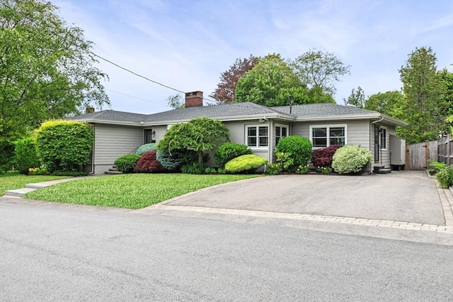 64 Pond St, Nahant, MA 01908 - ranch-style home featuring asphalt driveway and a chimney