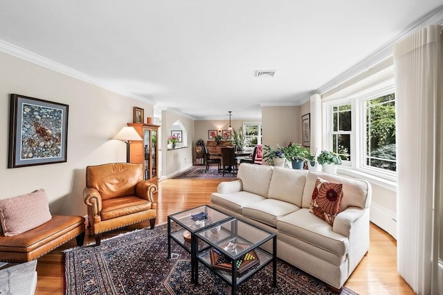 64 Pond St, Nahant, MA 01908 - living area with light wood finished floors and ornamental molding