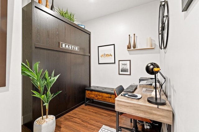 home office with wood-type flooring