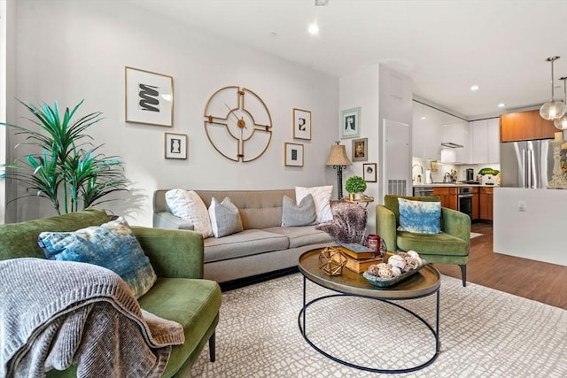 living room with light hardwood / wood-style flooring