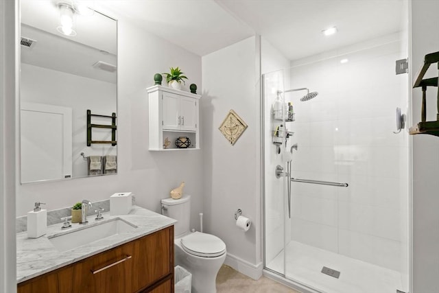 bathroom with vanity, an enclosed shower, and toilet