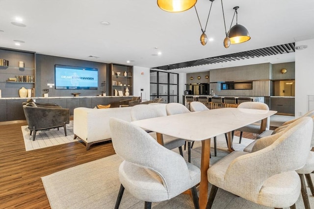 dining space with dark hardwood / wood-style floors