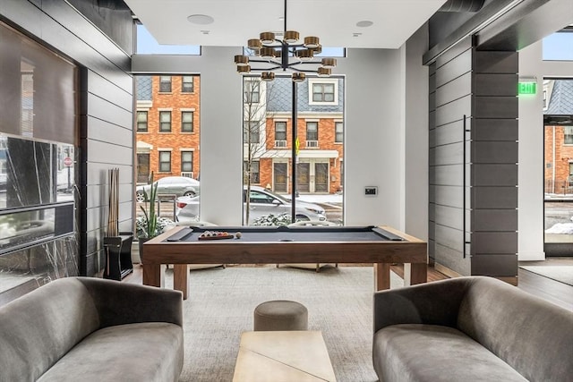 game room with an inviting chandelier and billiards