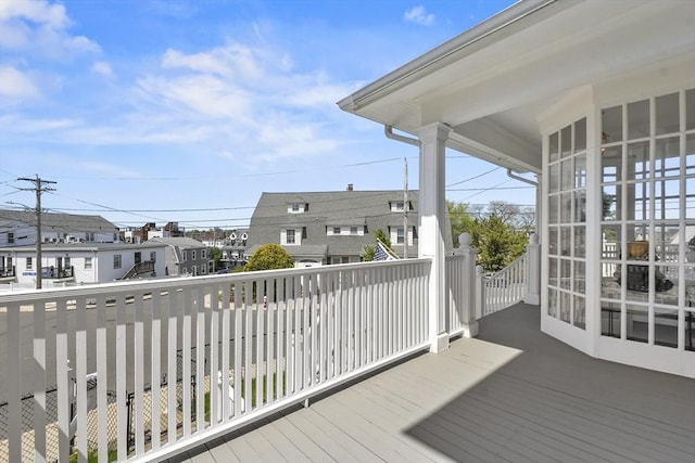 wooden terrace featuring a residential view