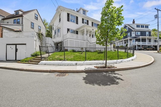 view of property's community with fence and a residential view