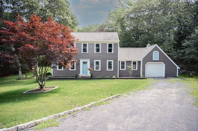 colonial inspired home featuring a front lawn