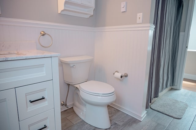 bathroom featuring toilet and vanity