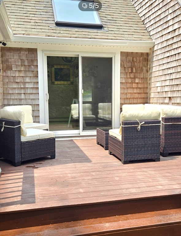 wooden deck featuring an outdoor living space