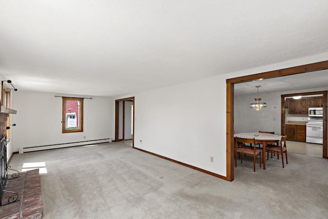 living room featuring baseboards, a baseboard radiator, a chandelier, and light colored carpet