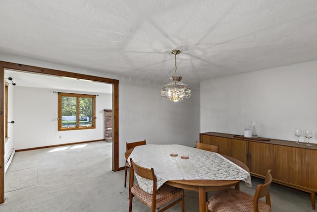 dining area with baseboard heating, baseboards, an inviting chandelier, and light carpet
