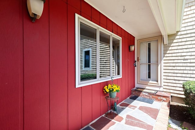 property entrance with brick siding