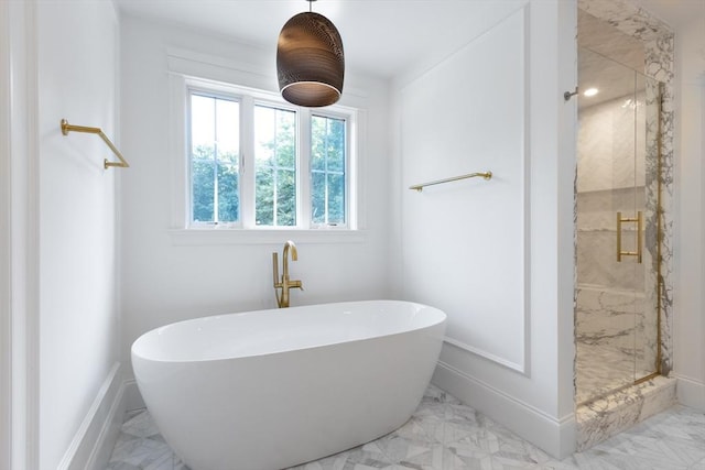 bathroom featuring independent shower and bath