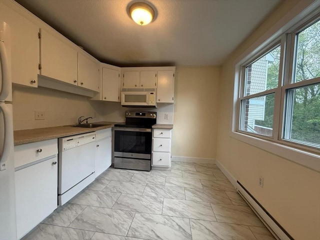 kitchen featuring a sink, baseboards, white appliances, marble finish floor, and a baseboard radiator