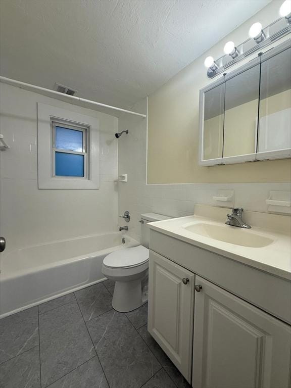bathroom featuring toilet, bathtub / shower combination, a textured ceiling, visible vents, and vanity
