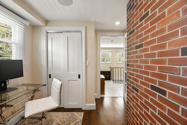 home office with dark wood finished floors, recessed lighting, and baseboards