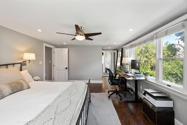 bedroom with a desk, dark wood-style flooring, recessed lighting, baseboards, and ceiling fan