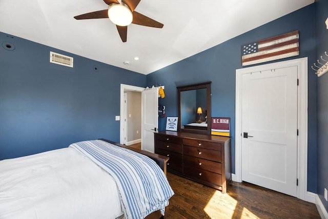 bedroom with wood finished floors, lofted ceiling, ceiling fan, and baseboards